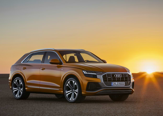 Orange Audi Q8 at Sunset