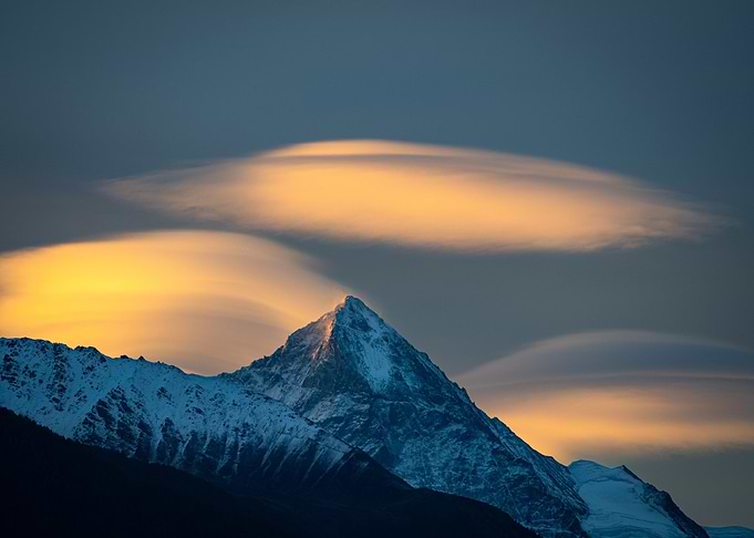 Snowy Mountain Peak with Lenticular Clouds
