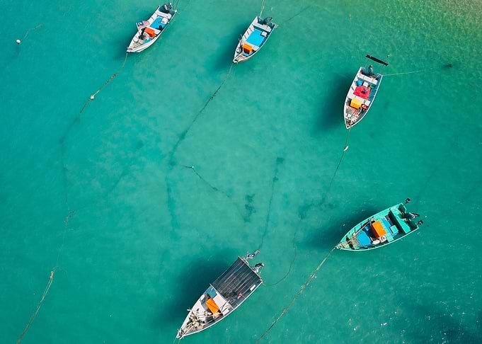Aerial view of boats in turquoise water