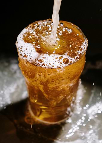 Beer Pouring into Glass