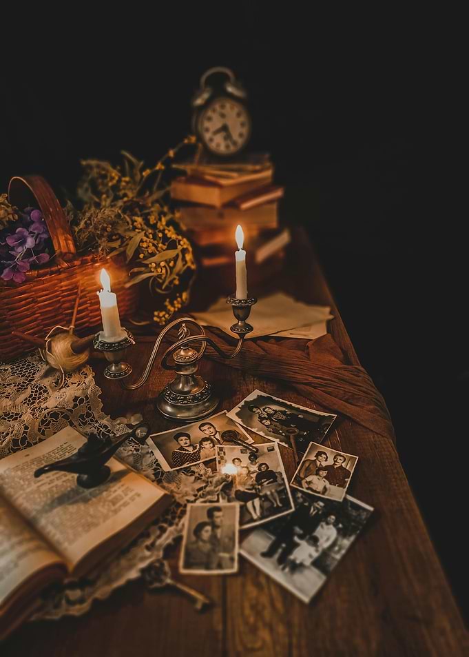 Vintage Still Life with Candles and Photos
