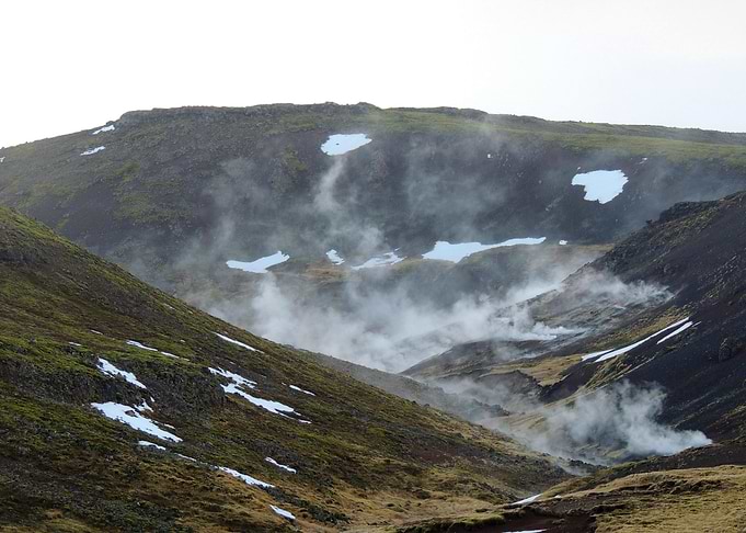 Geothermal Valley with Steam and Snow