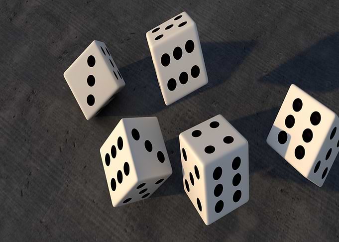 Scattered Dice on Gray Surface