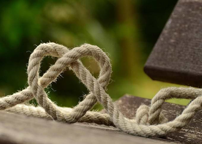 Rope Heart on Wooden Surface