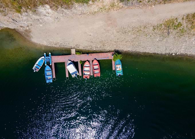 Boats Docked on a Lake Pier