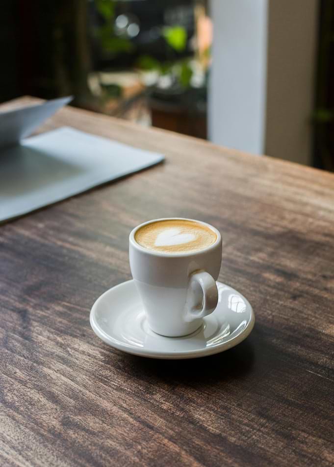 Coffee cup with heart latte art