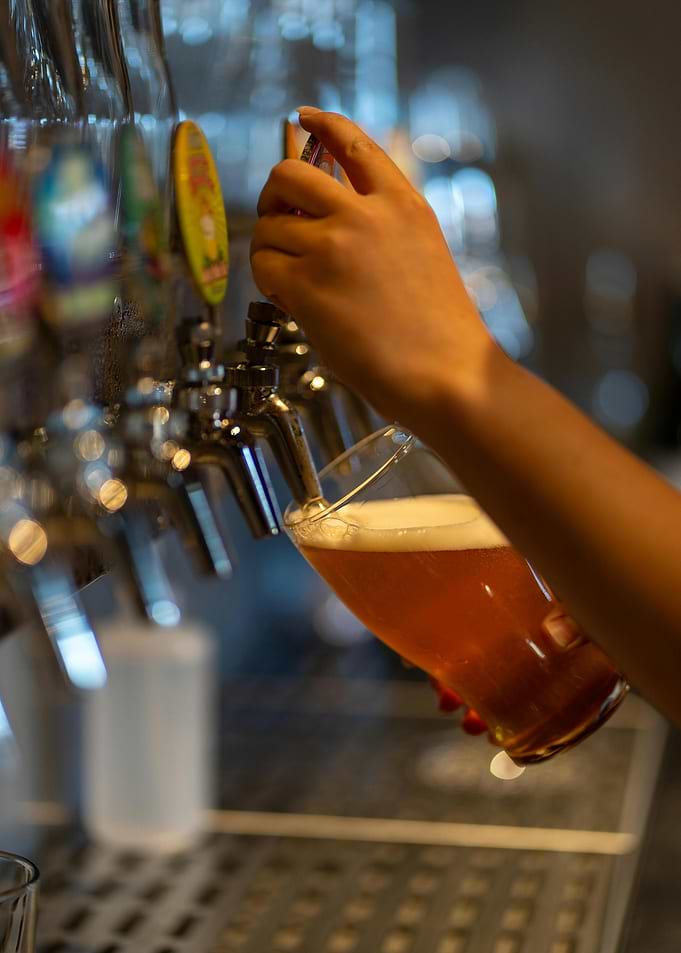 Pouring Beer from Tap into Glass