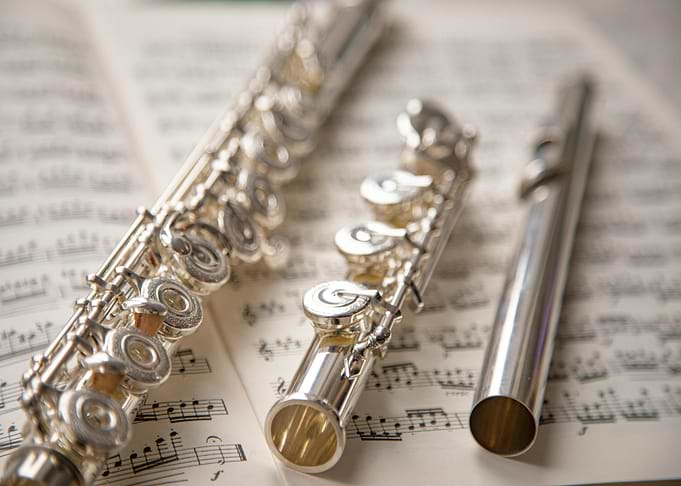 Silver Flute on Sheet Music