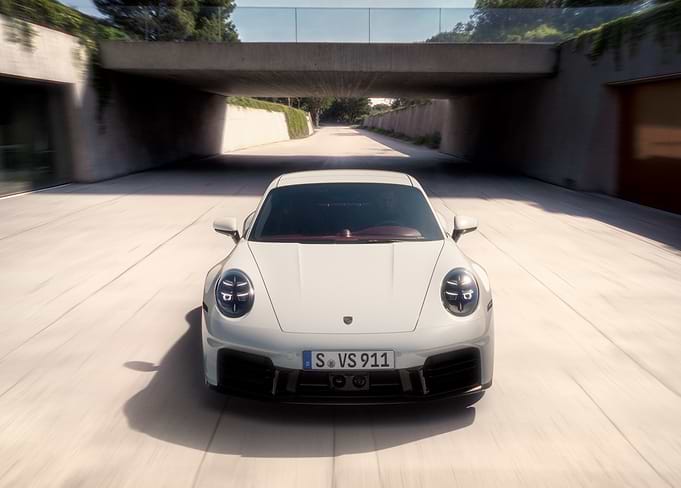 White Porsche 911 Under Concrete Arch