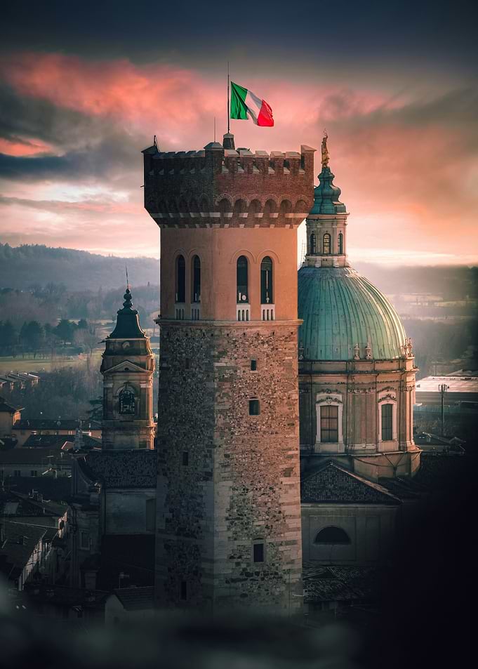 Rocca di Lonato with Flag at Sunset