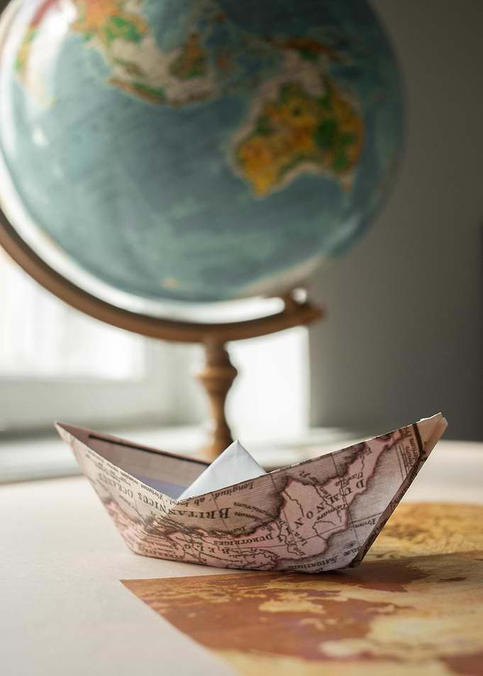Paper Boat and Globe Still Life