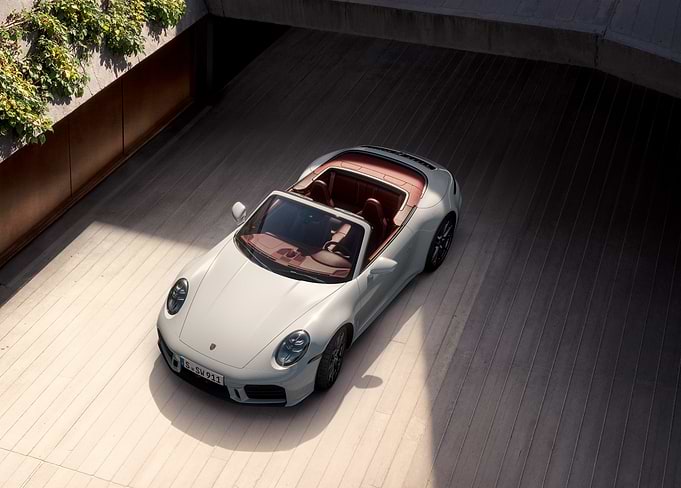 Sleek White Porsche in Architectural Garage