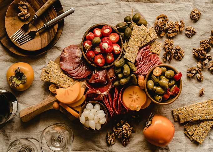 Charcuterie board with fruits and snacks