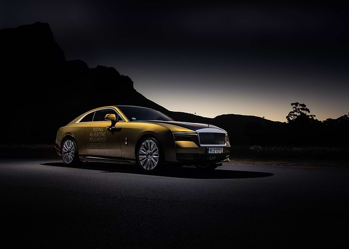 Gold Rolls-Royce Spectre at Dusk