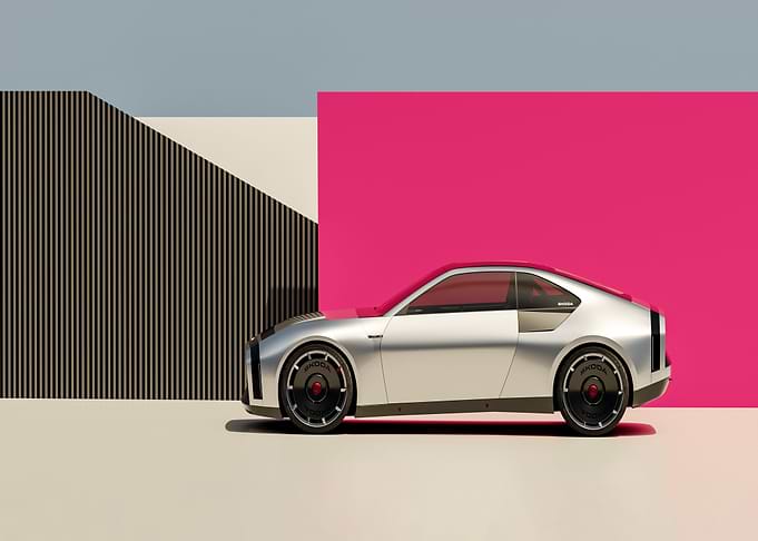 Silver Skoda Car with Geometric Background