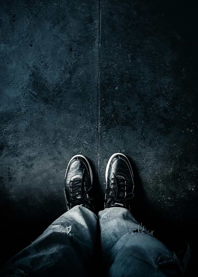 Dark Shoes on Concrete