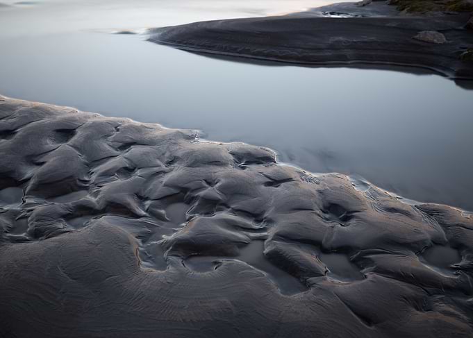 Textured Sand and Water Landscape