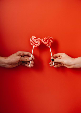 Heart Lollipops on Red Background