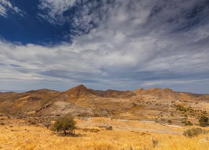 Dry Mountain Landscape with Cloudy Sky, Greek Island