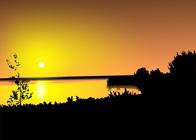 Sunset over water silhouette landscape