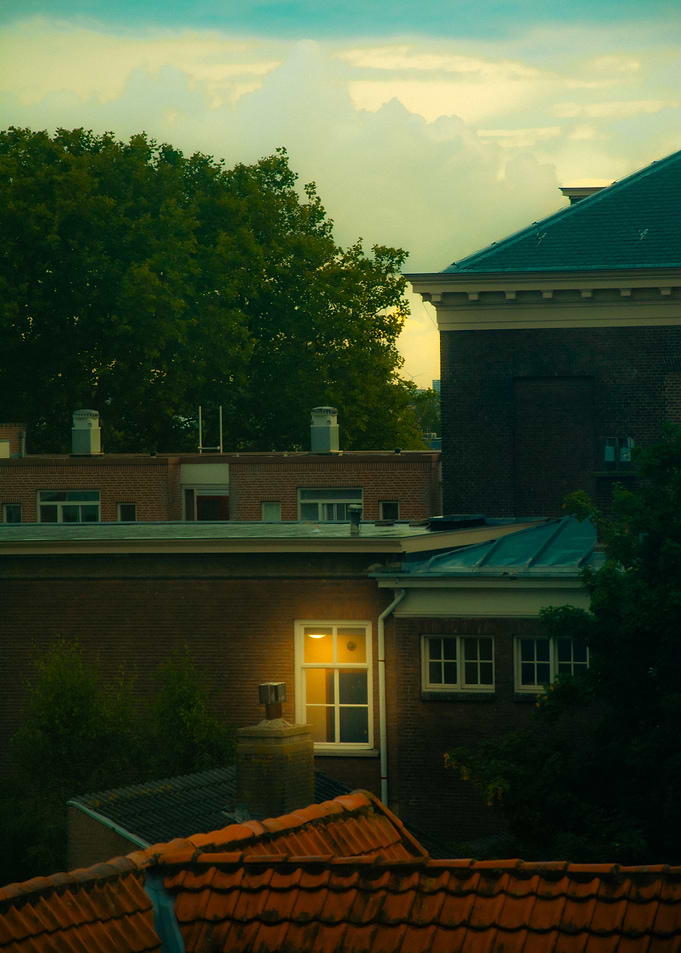 Rooftop view with illuminated window
