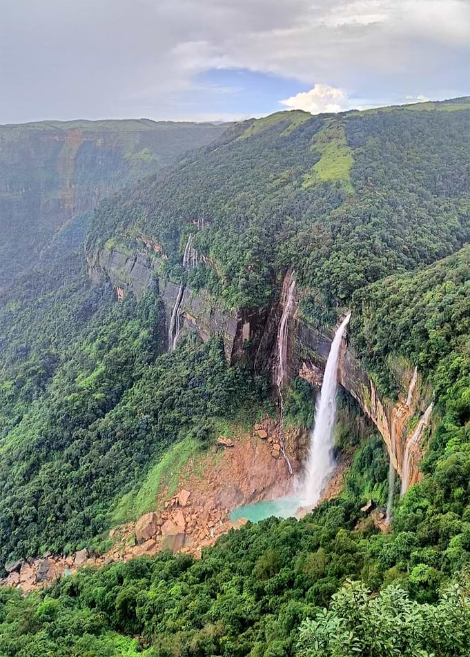 Majestic Waterfall in Lush Green Landscape
