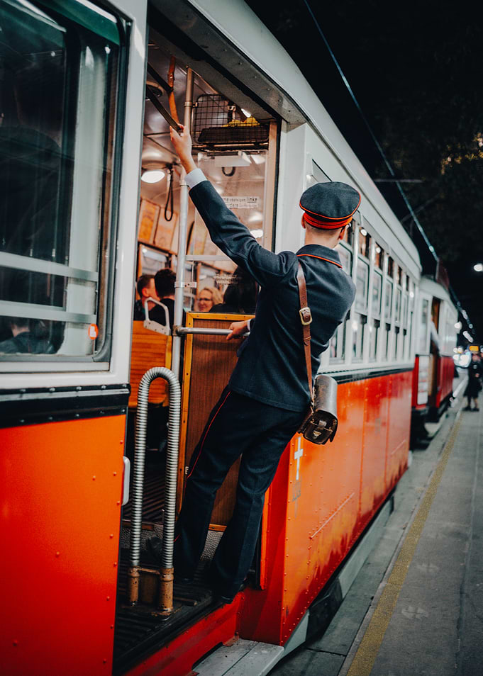 Vintage Tram Conductor at Work