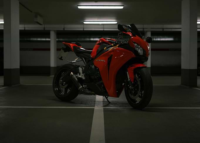 Red CBR Motorcycle in Parking Garage