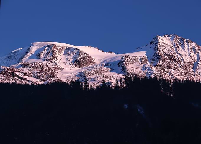 Snowy Mountain Peak at Sunset