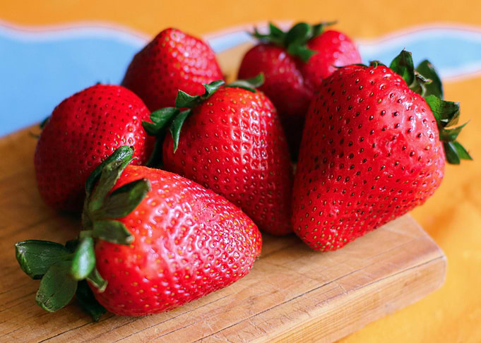 Fresh Strawberries on Wooden Cutting Board