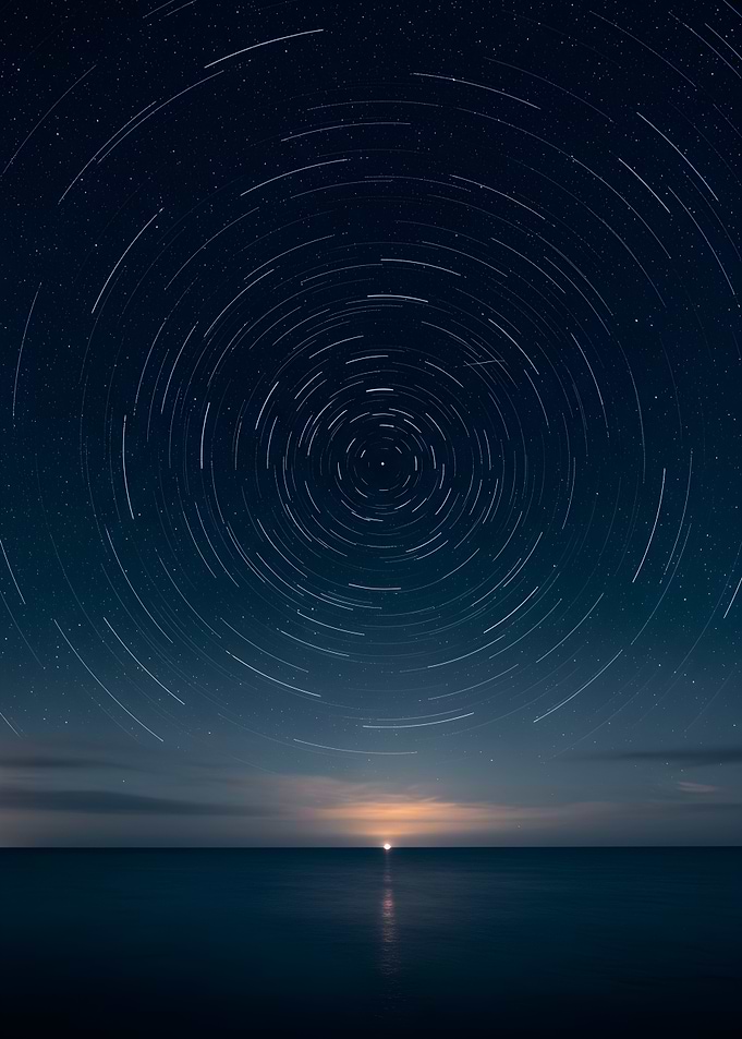 Star Trails Over Ocean at Night