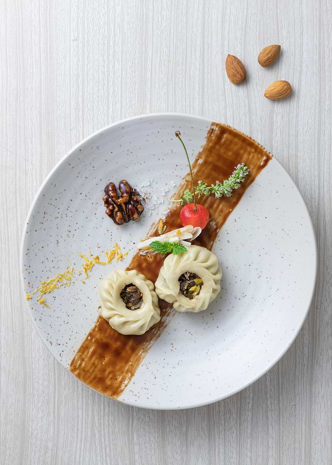 Gourmet Dumpling Dish with Cherry