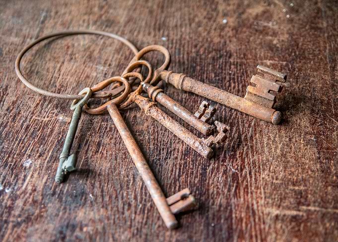 Antique Rusty Keys on Wooden Surface