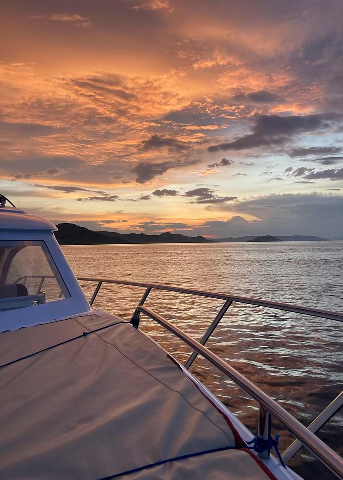 Boat at Sea During Sunset