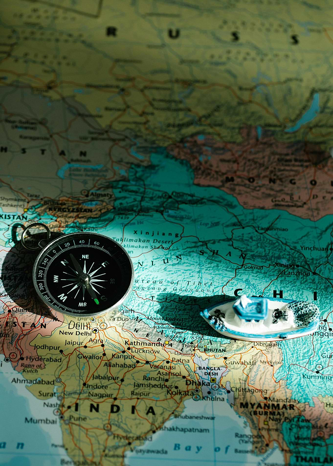 Compass and Boat on World Map