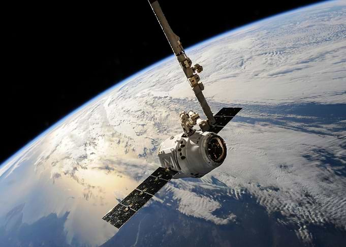 Spacecraft docking with Earth in background