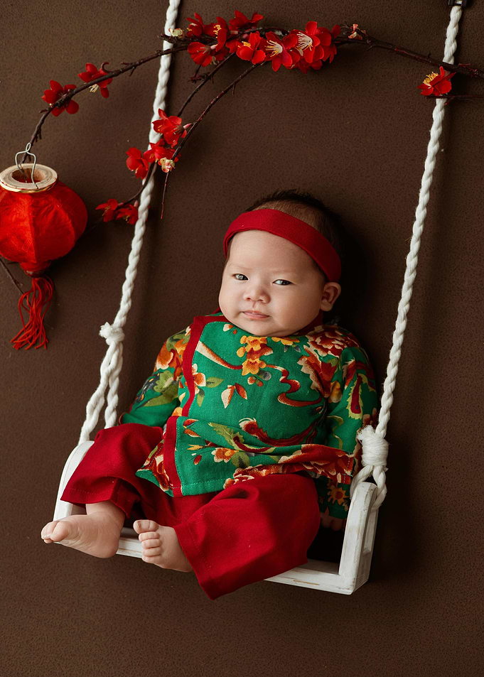 Baby on Swing with Asian Decor