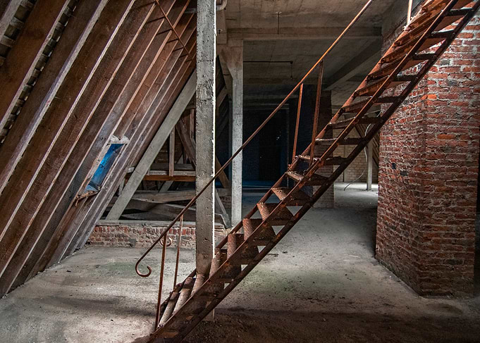 Abandoned Building Interior with Rusty Staircase