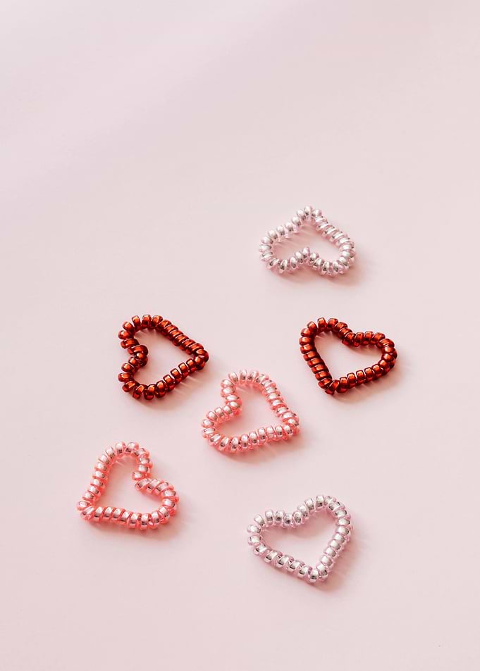 Beaded Heart Shapes on Pink Background