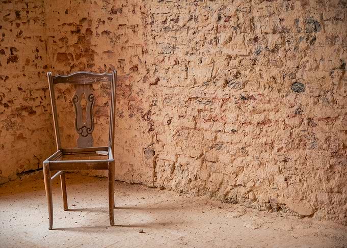 Rustic Chair Against Textured Wall