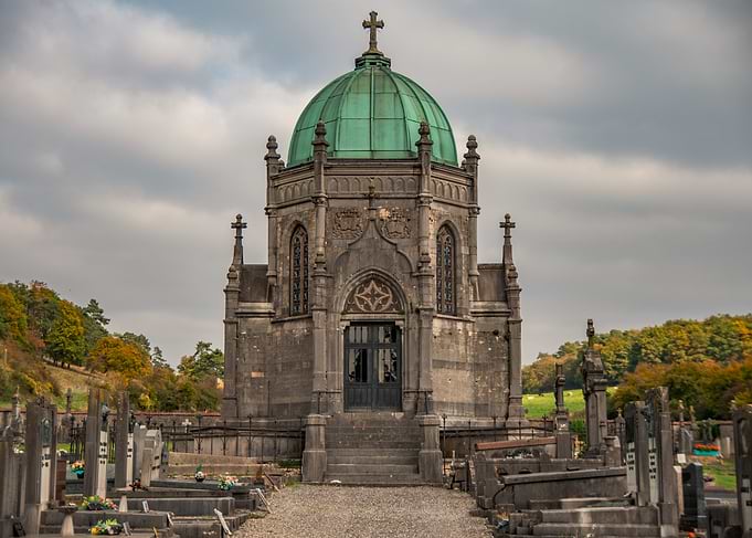 Ornate Mausoleum in Cemetery Landscape