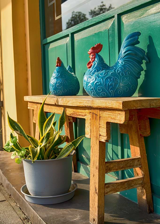 Decorative Roosters on Wooden Bench