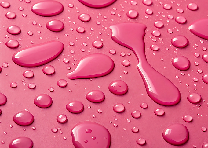Glossy Pink Droplets on Textured Surface