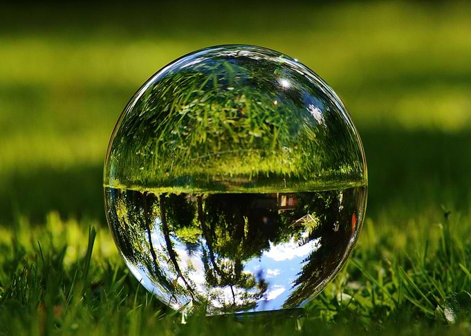 Crystal ball reflecting nature scene