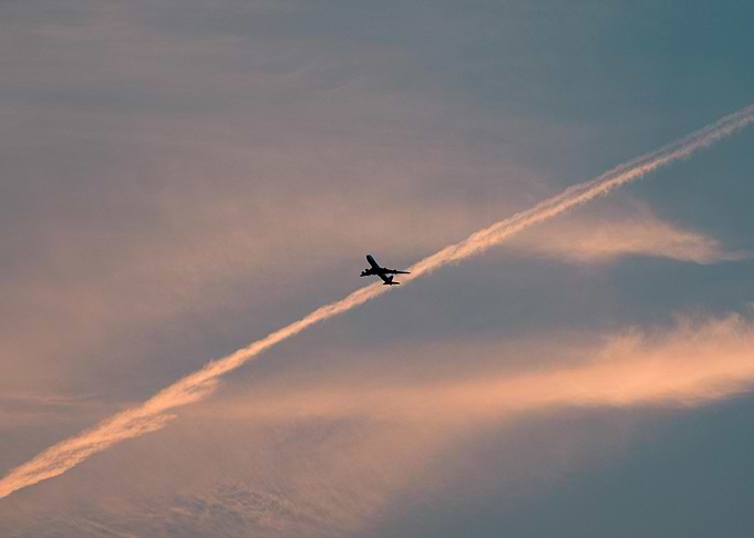 Airplane flying through the sky