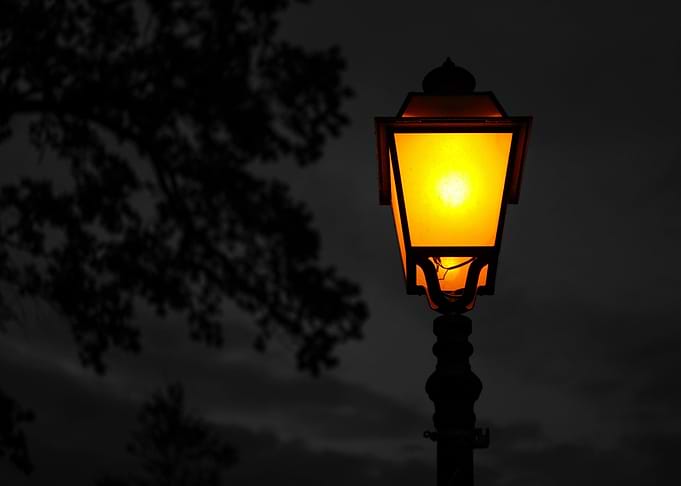 Glowing street lamp at night