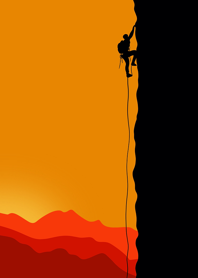 Silhouette Rock Climber at Sunset