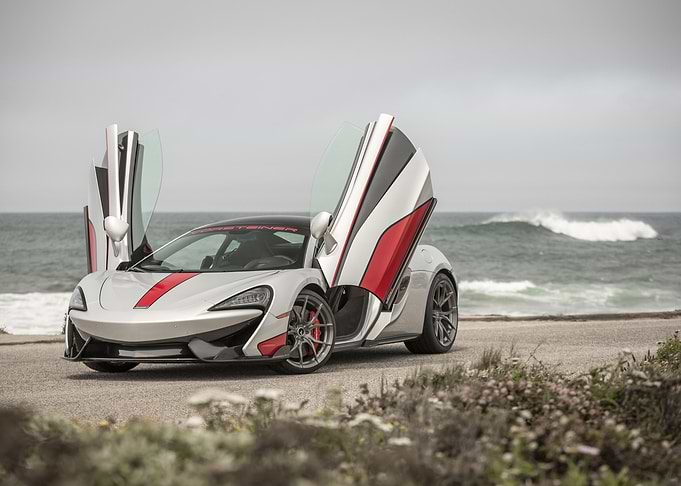Silver McLaren with Open Doors by Ocean