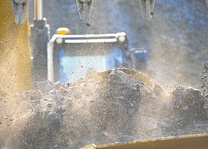Excavator Digging Soil and Rocks