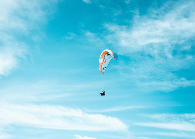 Paragliding in a blue sky
